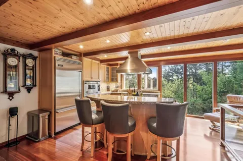 a dining table with chairs and wooden floor