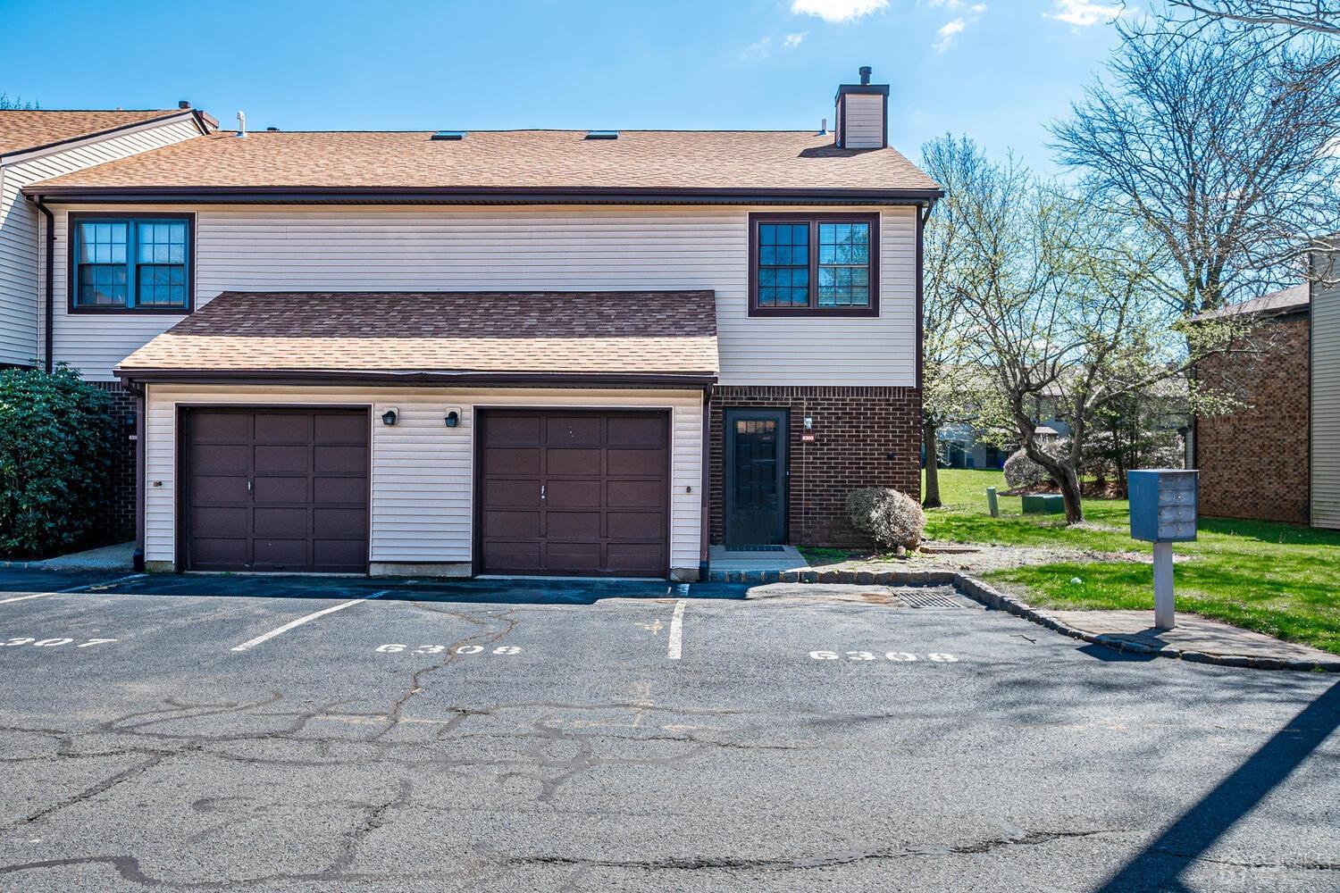 6308 Hana Road Edison, NJ 08817 - Photo 1 of 35 a front view of a house with a yard and garage
