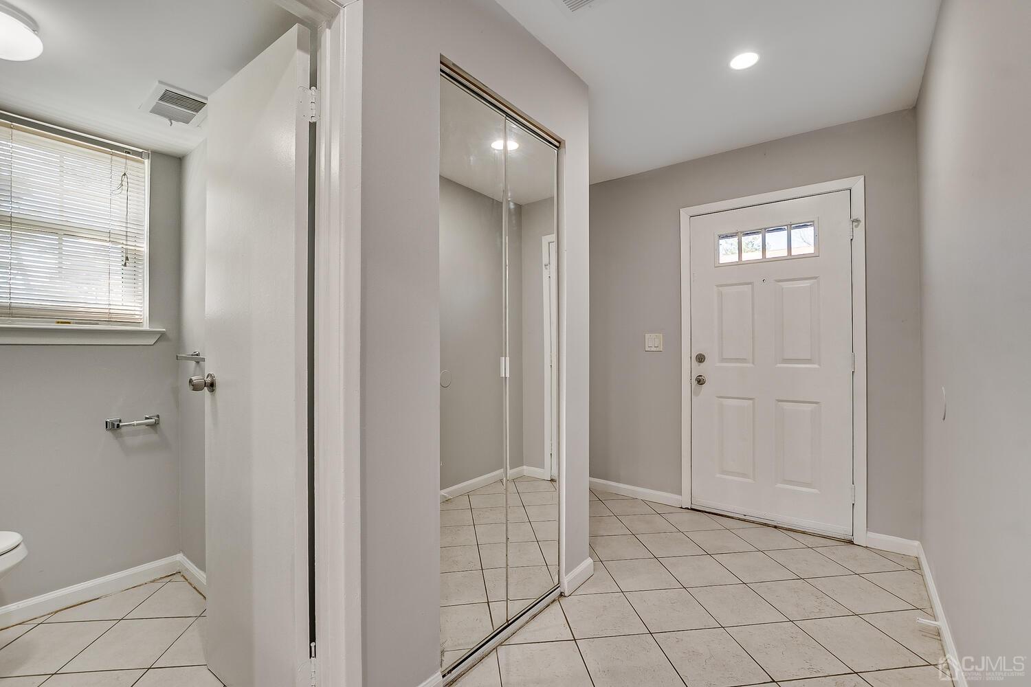 6308 Hana Road Edison, NJ 08817 - Photo 3 of 35 a spacious bathroom with a mirror