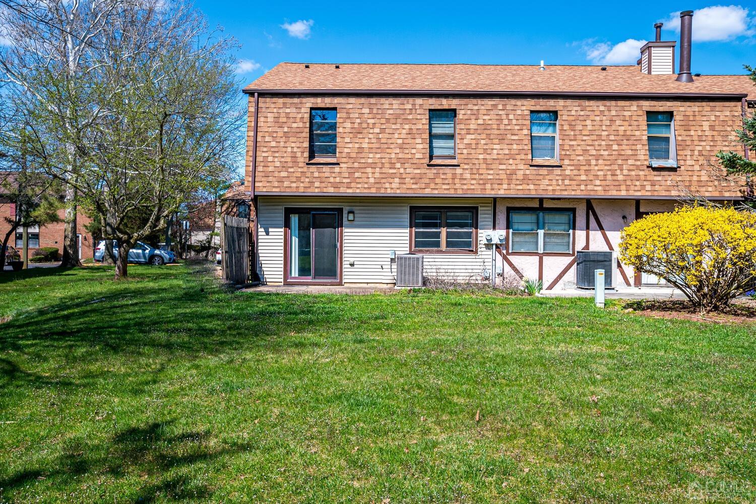 6308 Hana Road Edison, NJ 08817 - Photo 34 of 35 a front view of a house with a garden