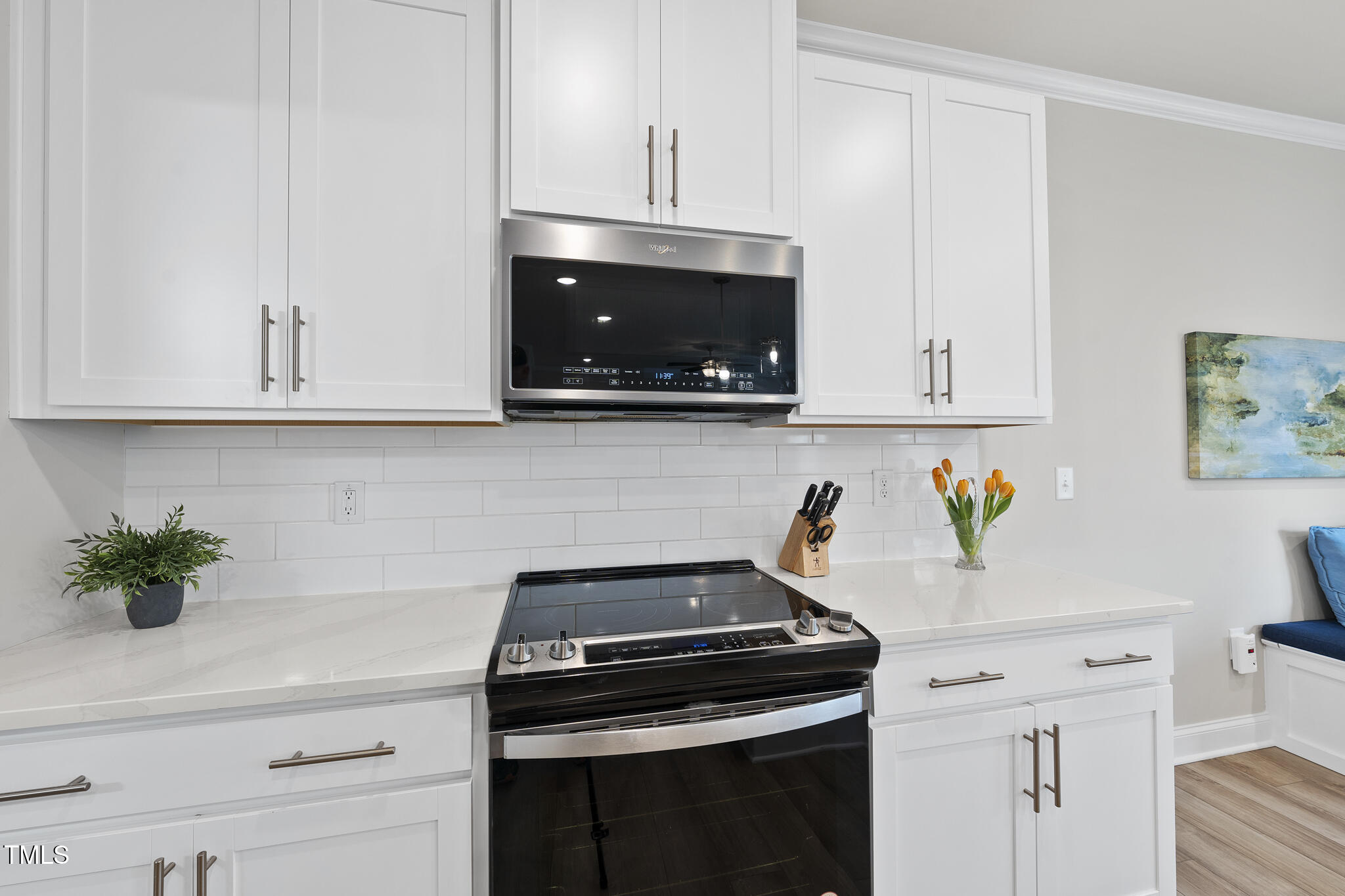 111 Kim Bark Path Garner, NC 27529 - Photo 14 of 52 a kitchen with a stove and a white cabinets