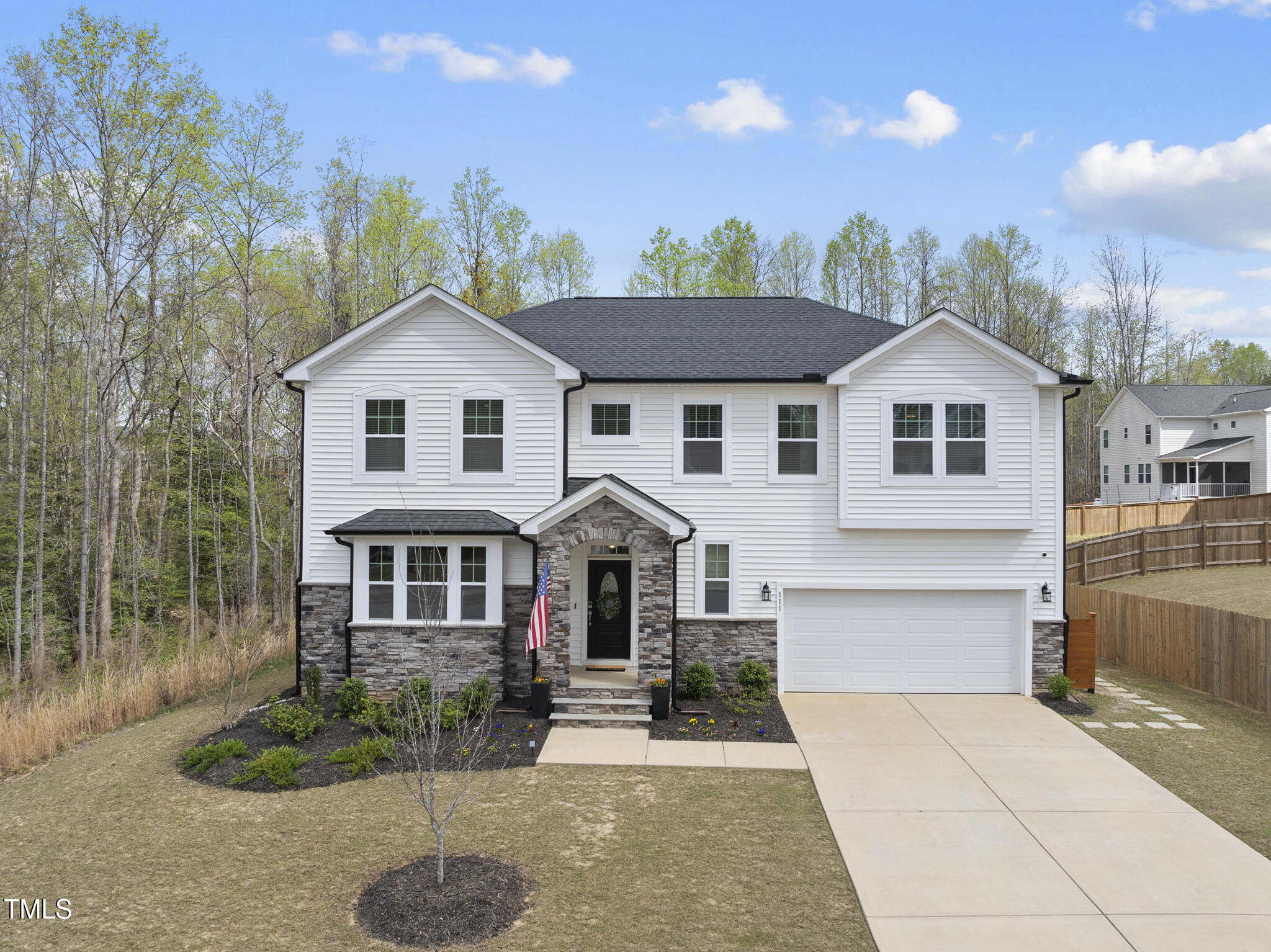 111 Kim Bark Path Garner, NC 27529 - Photo 2 of 52 a front view of a house with a yard and garage