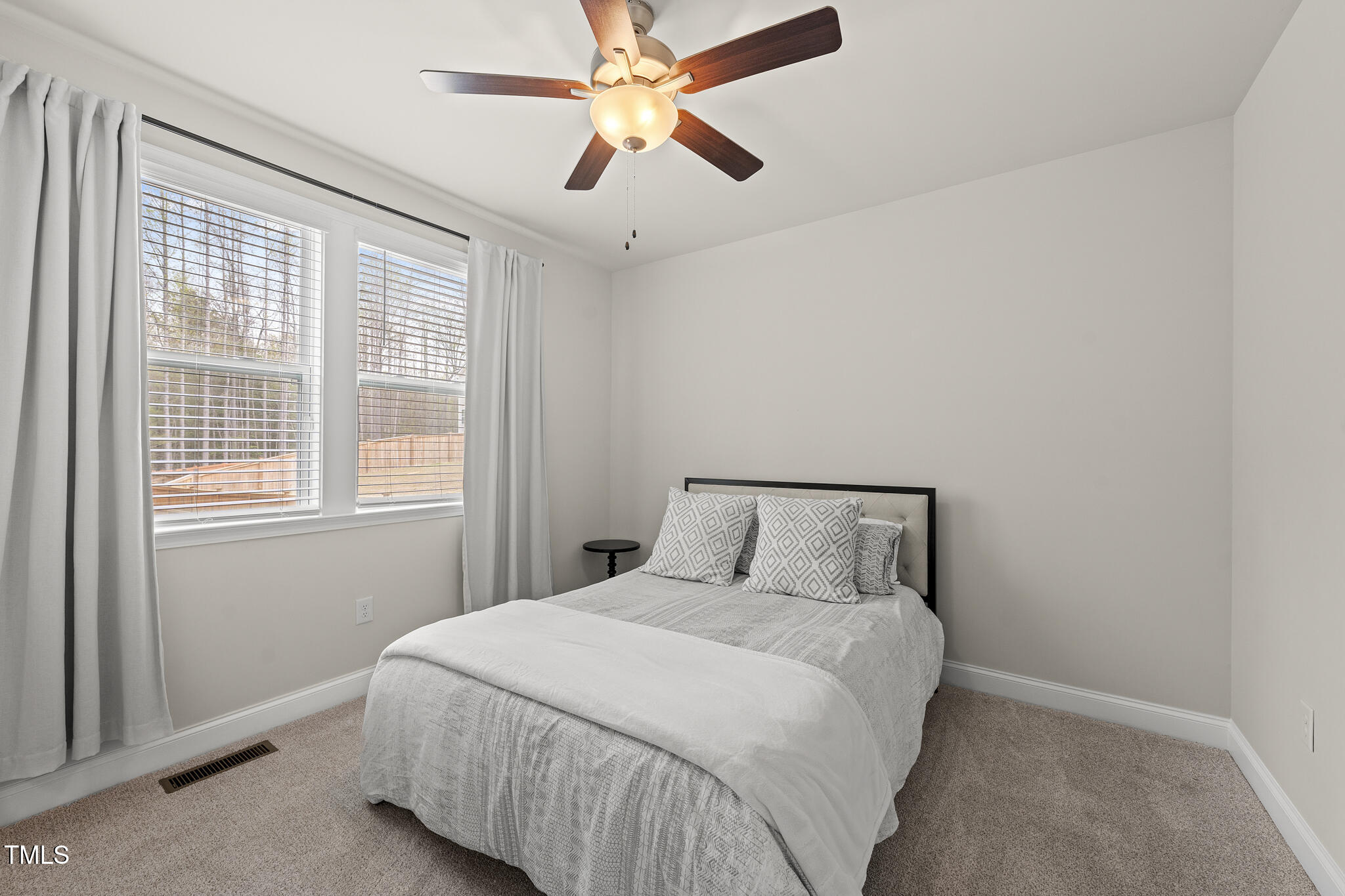 111 Kim Bark Path Garner, NC 27529 - Photo 25 of 52 a bedroom with a bed and a window
