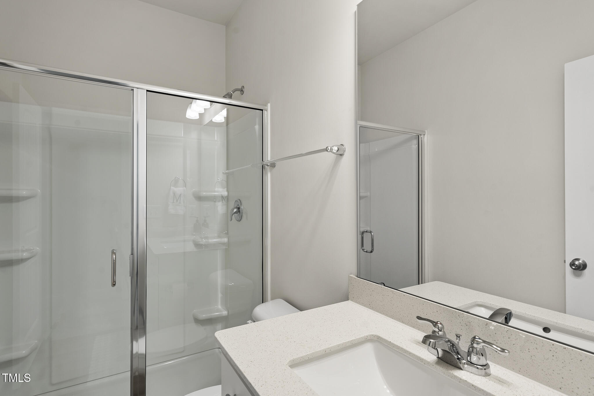 111 Kim Bark Path Garner, NC 27529 - Photo 27 of 52 a bathroom with a sink and shower