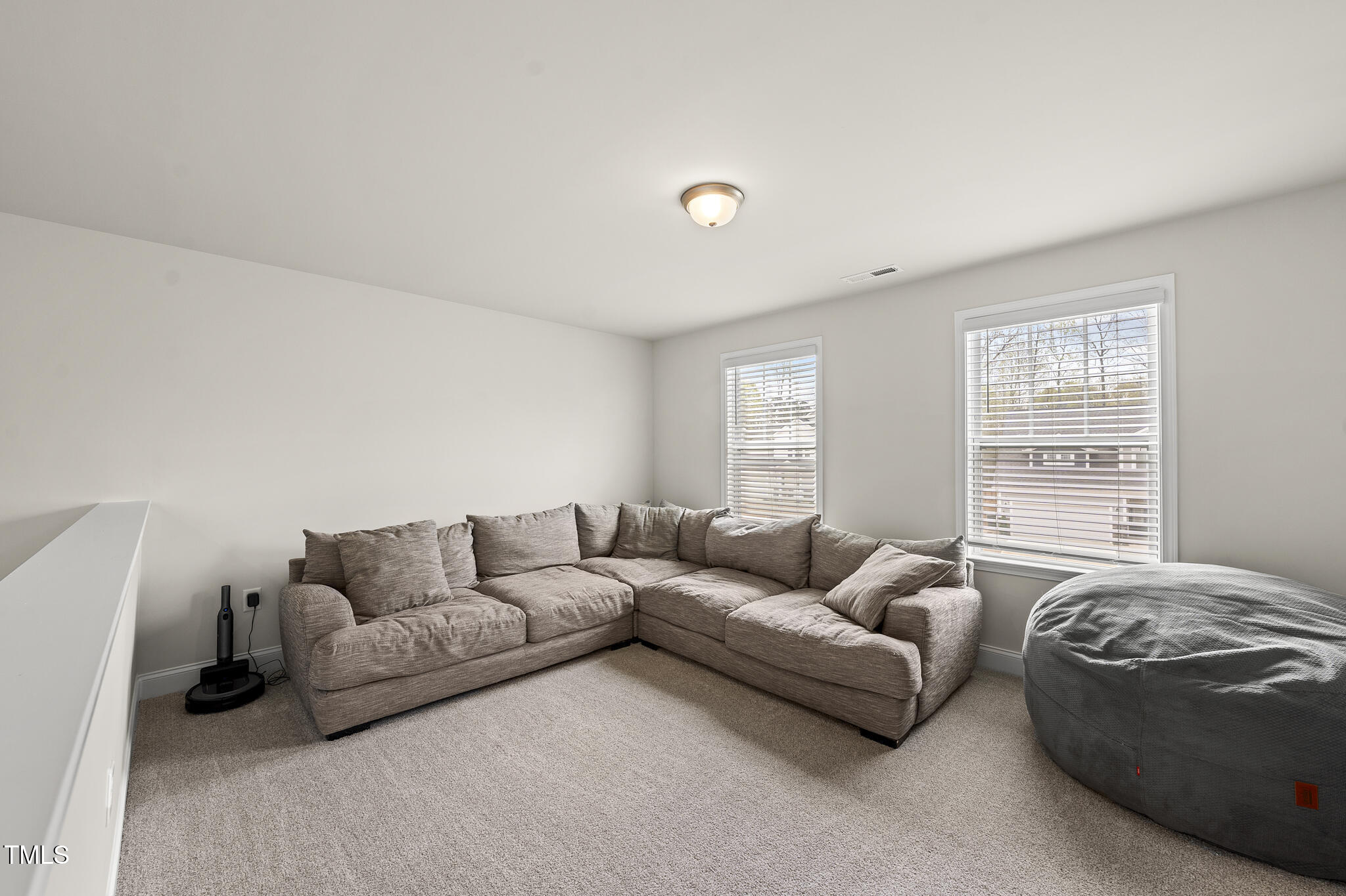 111 Kim Bark Path Garner, NC 27529 - Photo 28 of 52 a living room with furniture and a window