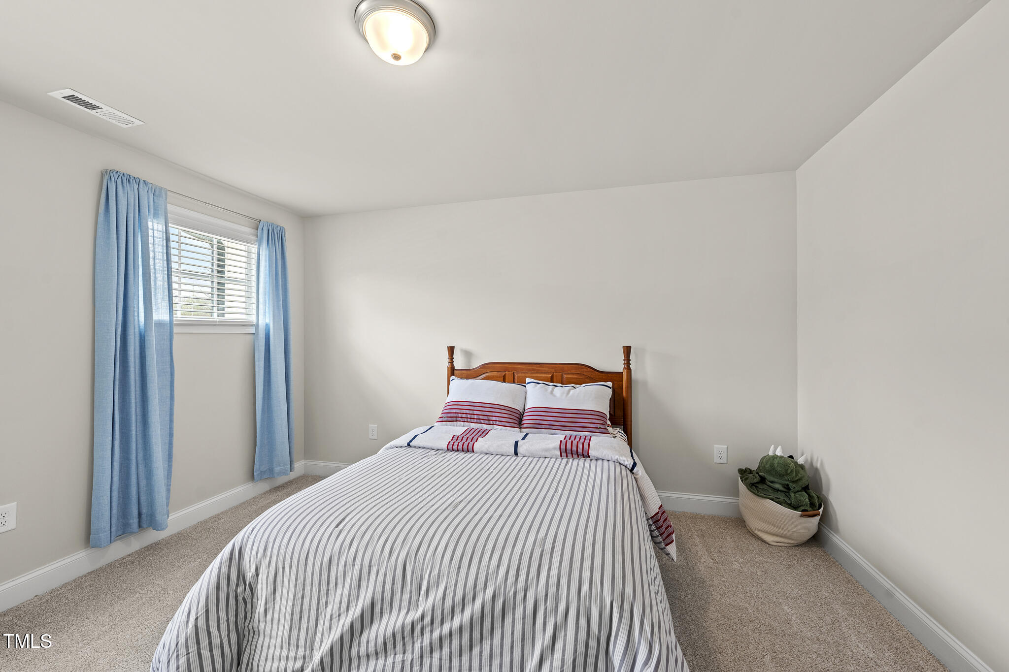 111 Kim Bark Path Garner, NC 27529 - Photo 35 of 52 a bedroom with a bed and potted plant