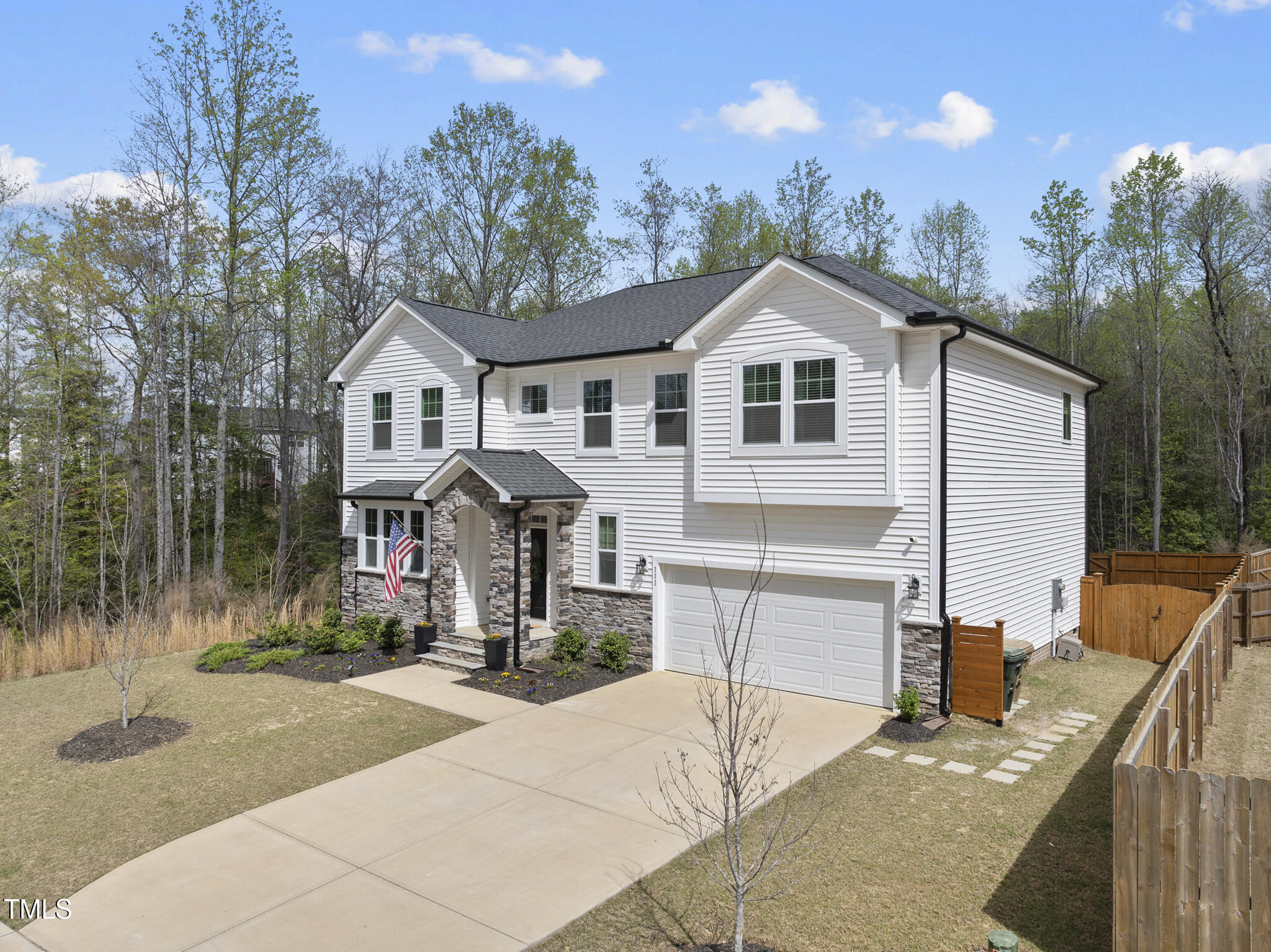111 Kim Bark Path Garner, NC 27529 - Photo 4 of 52 a front view of a house with yard and trees in the background