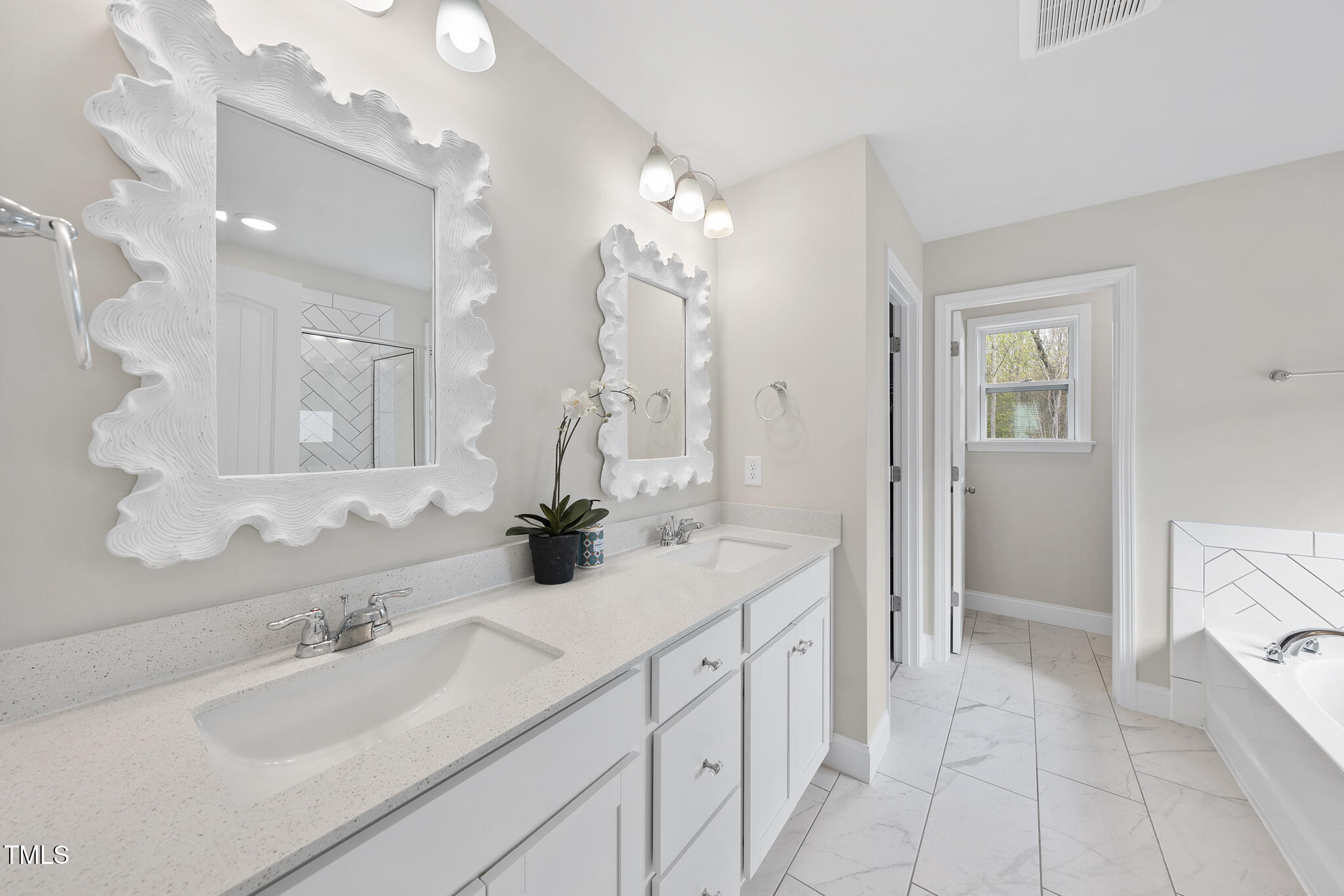 111 Kim Bark Path Garner, NC 27529 - Photo 42 of 52 a bathroom with a sink and a mirror