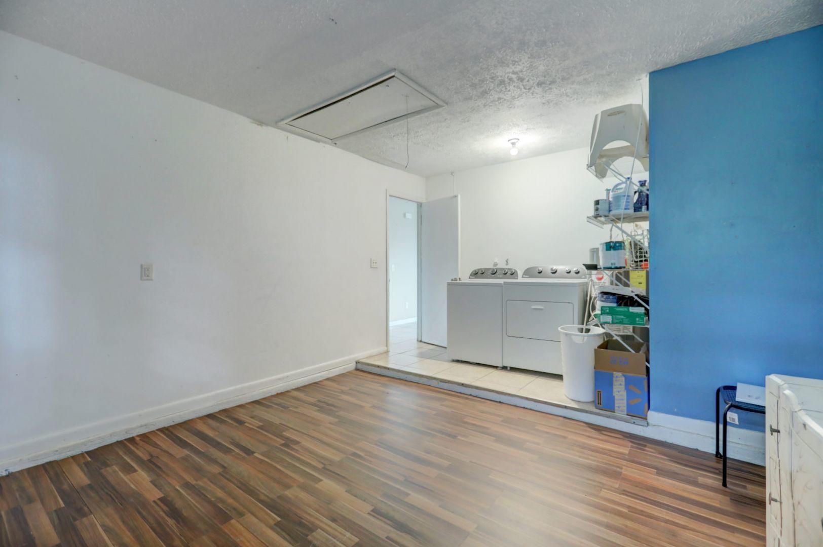 370 Southwest Undallo Road Port St. Lucie, FL 34953 - Photo 18 of 39 Garage Room and Laundry