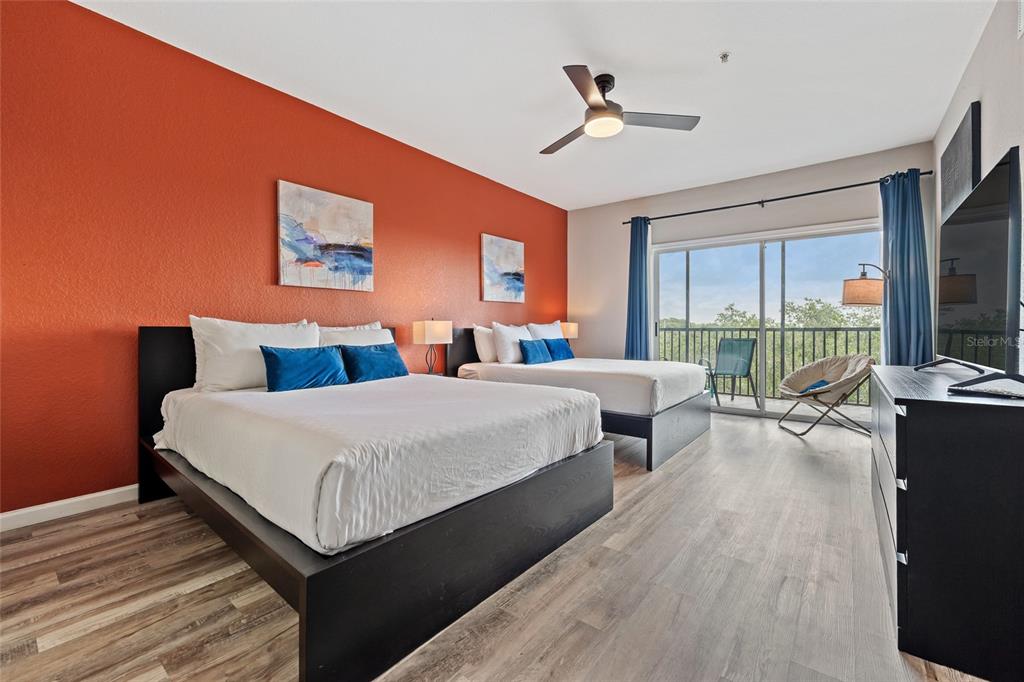 14200 Avalon Road, Unit 409 Winter Garden, FL 34787 - Photo 22 of 33 a bed room with a bed and a large window