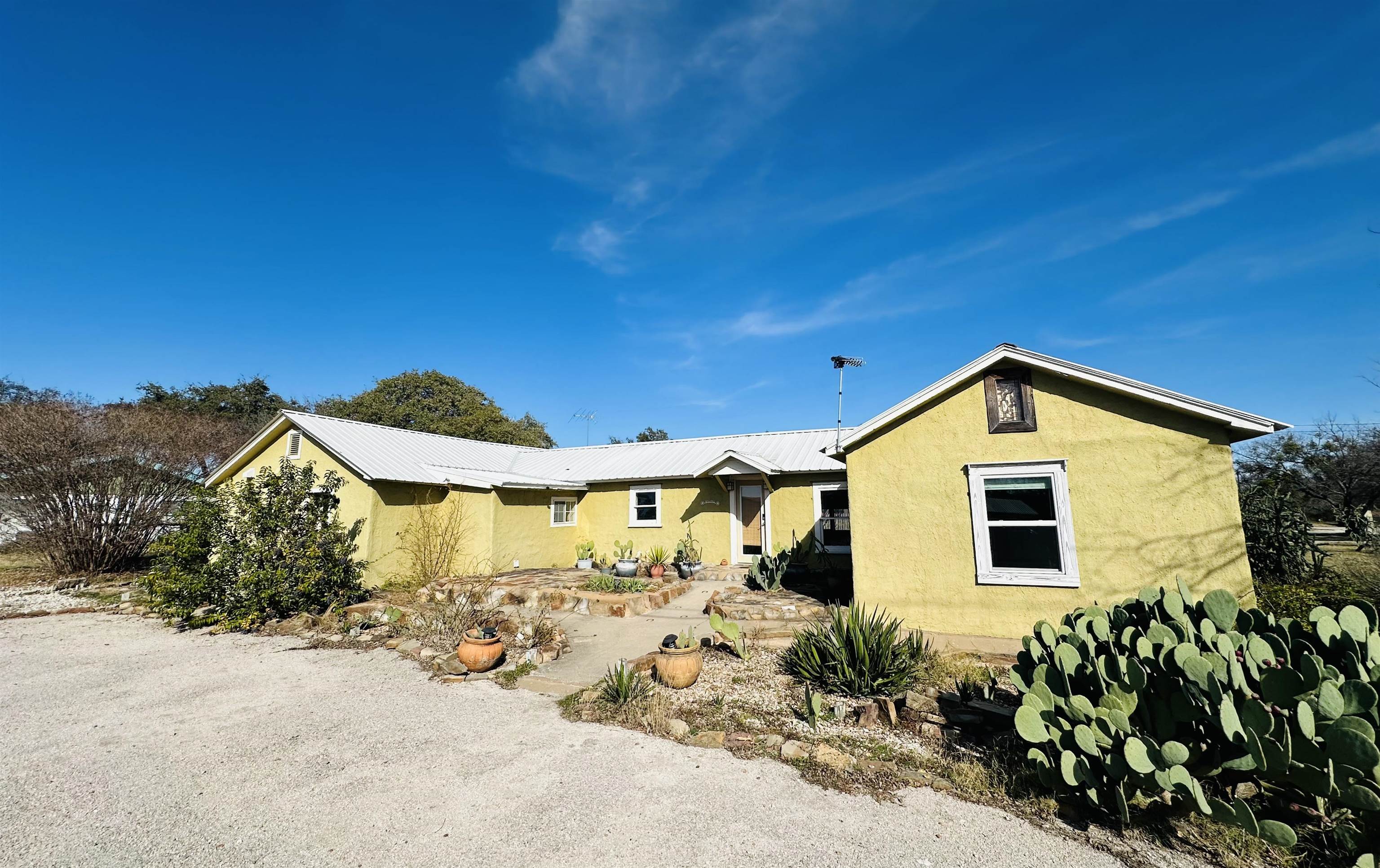 505 4th Street Lometa, TX 76853 - Photo 1 of 27 a front view of a house with a yard