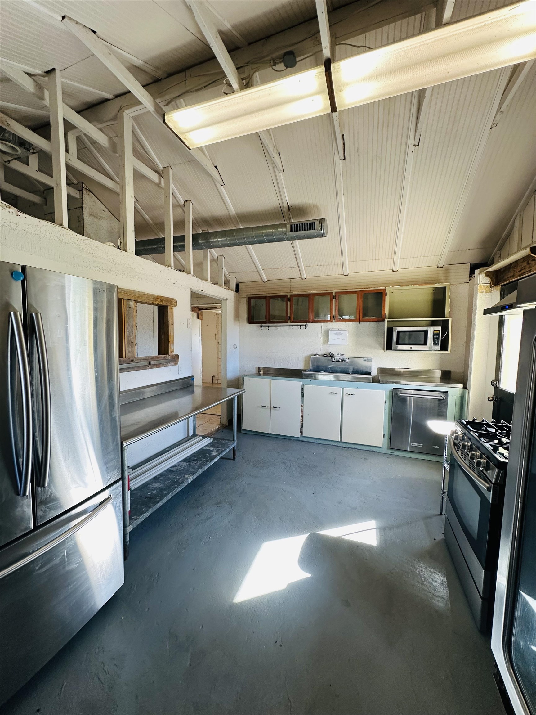 505 4th Street Lometa, TX 76853 - Photo 16 of 27 a view of storage and utility room with racks a kitchen