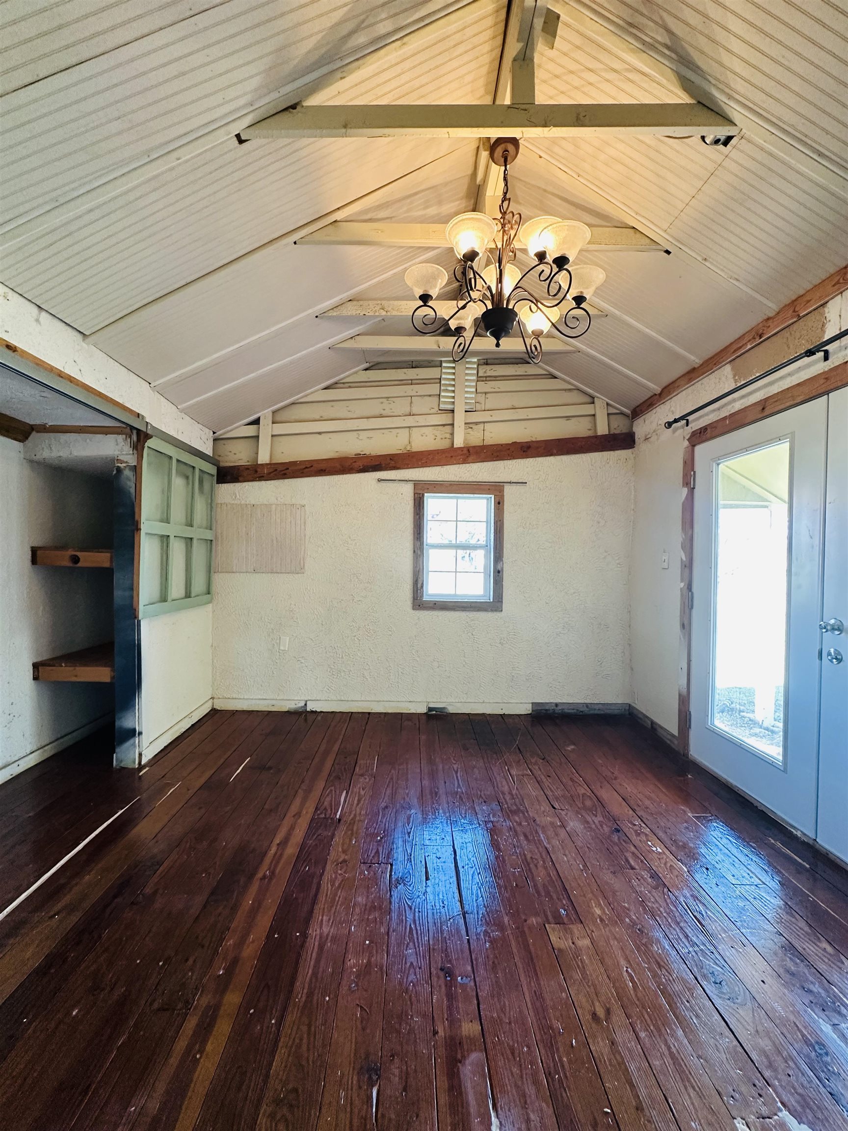 505 4th Street Lometa, TX 76853 - Photo 19 of 27 a view of room with window wooden floor and chandelier