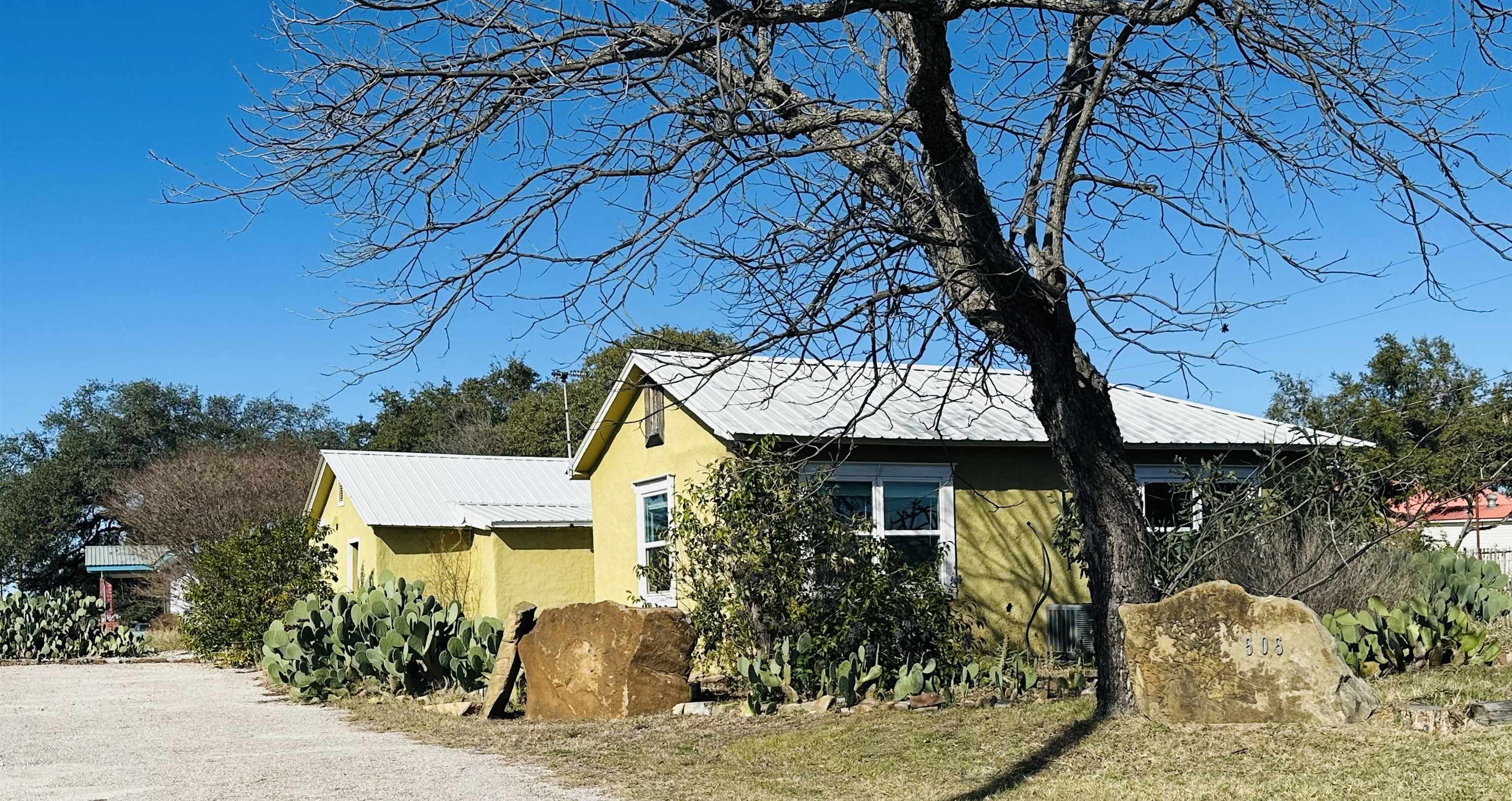 505 4th Street Lometa, TX 76853 - Photo 2 of 27 a front view of a house with garden