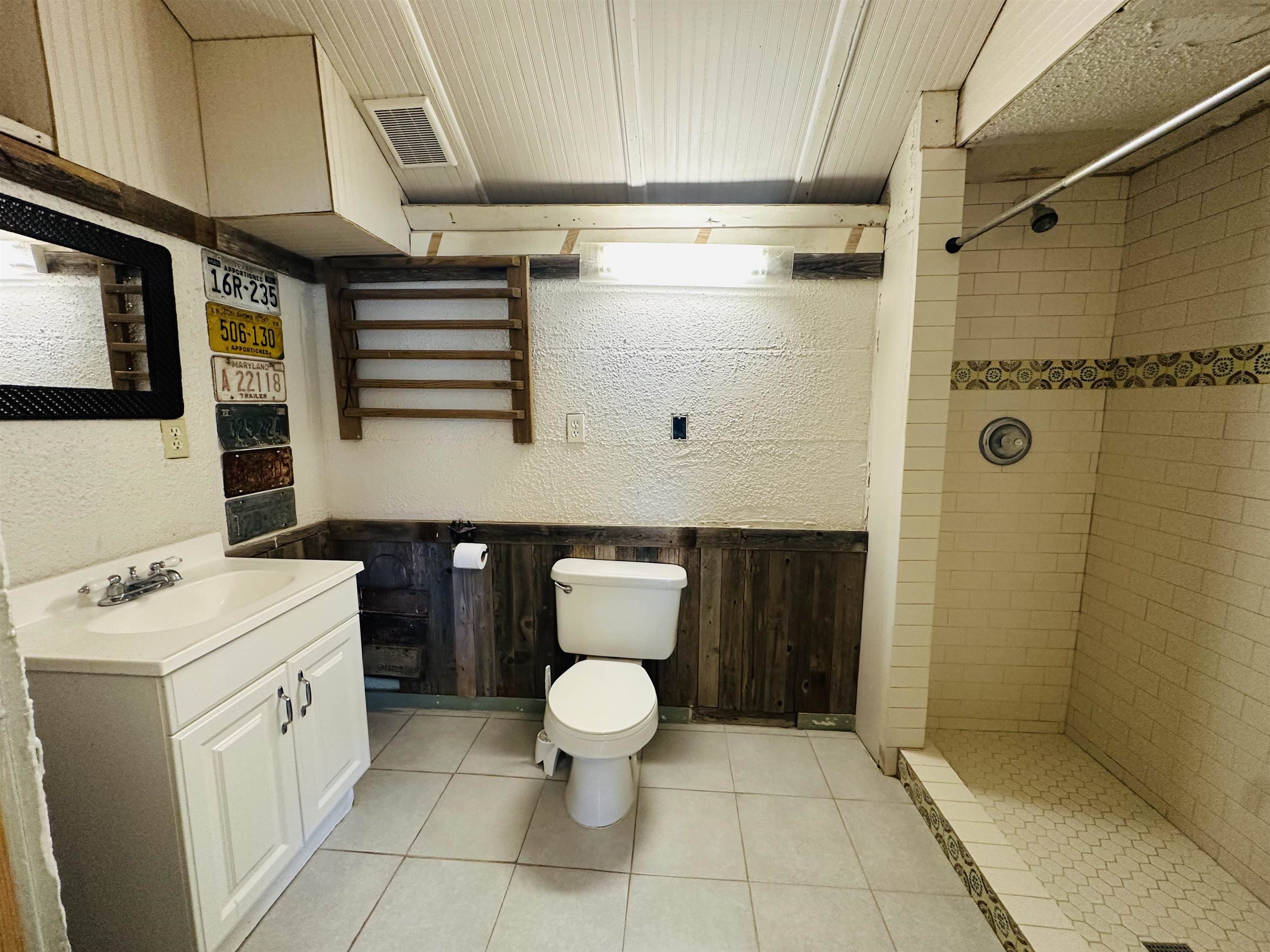 505 4th Street Lometa, TX 76853 - Photo 21 of 27 a bathroom with a sink a toilet and shower