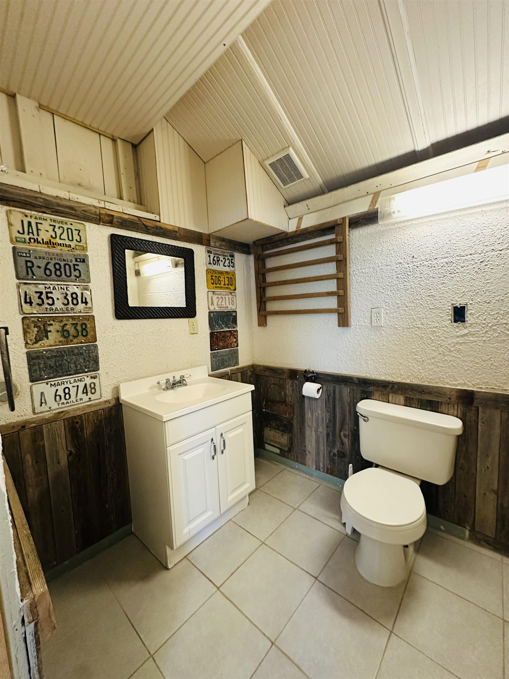 505 4th Street Lometa, TX 76853 - Photo 22 of 27 a bathroom with a toilet sink and mirror