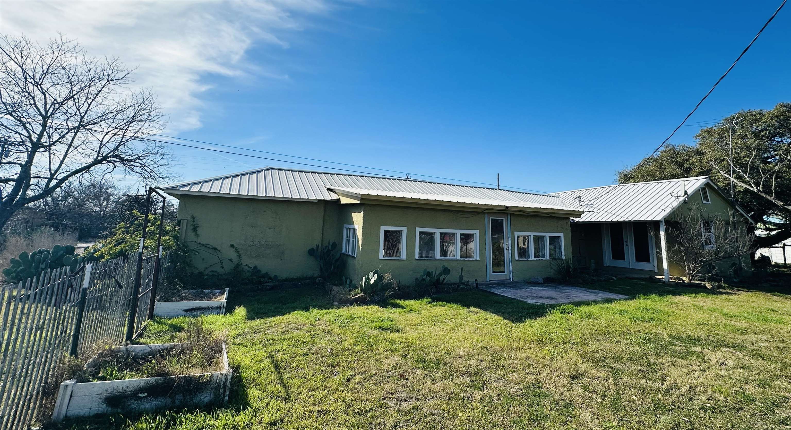505 4th Street Lometa, TX 76853 - Photo 26 of 27 a front view of a house with garden