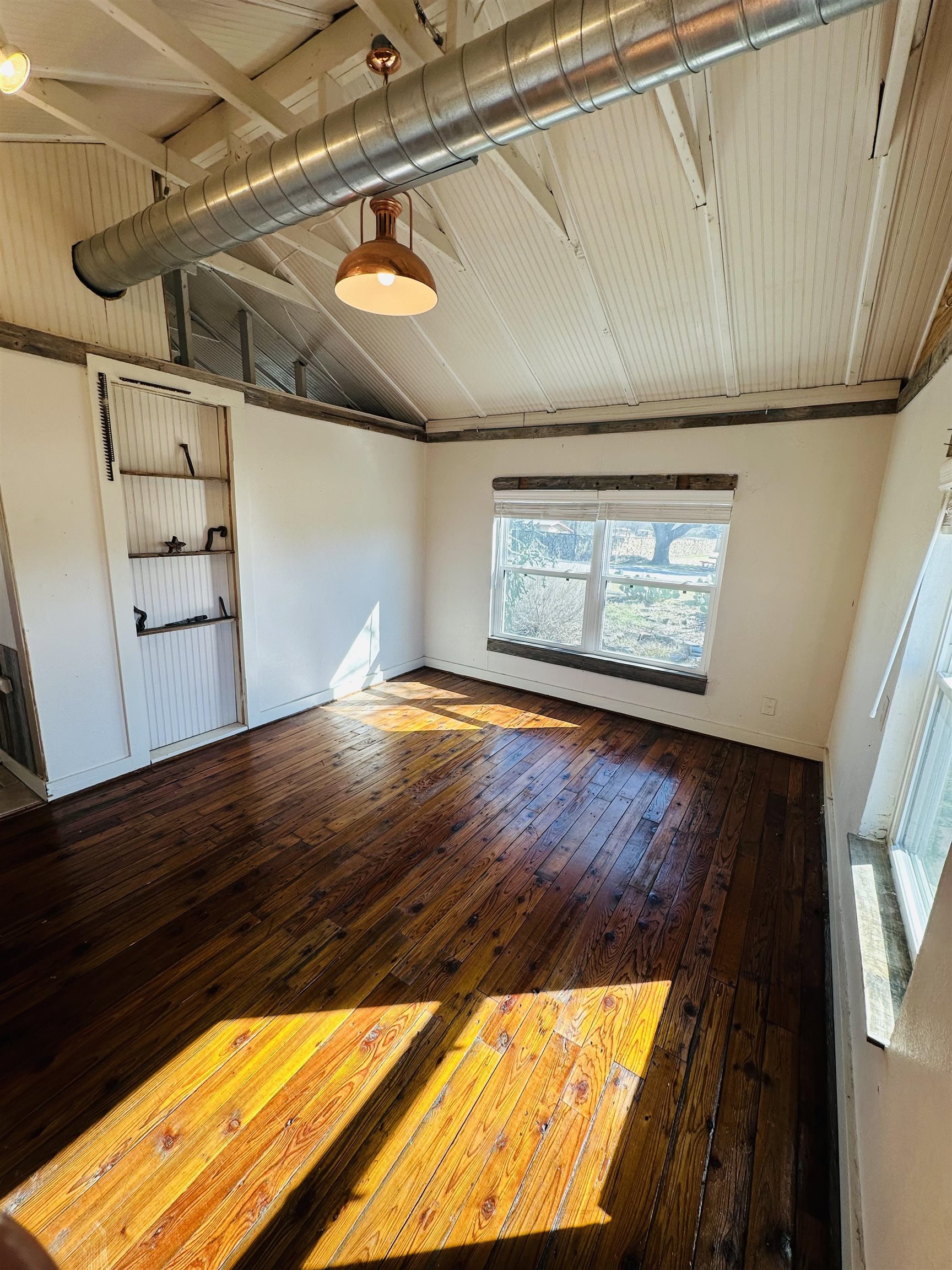 505 4th Street Lometa, TX 76853 - Photo 8 of 27 a view of empty room with wooden floor