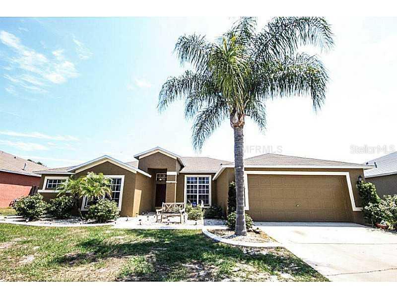 1705 Honey Ridge Place Valrico, FL 33594 - Photo 1 of 1 a front view of a house with yard and garage