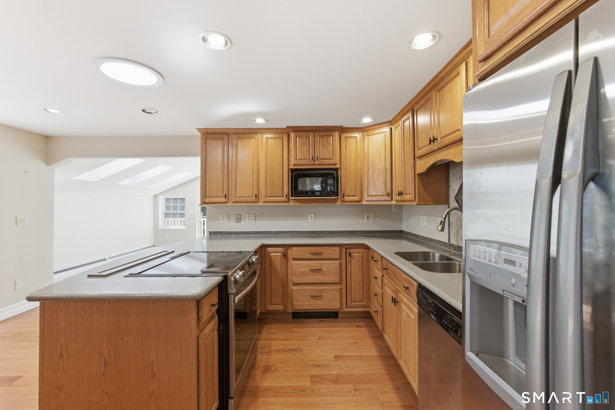 70 Mahoney Road Colchester, CT 06415 - Photo 8 of 40 a kitchen with granite countertop a refrigerator stove top oven and sink