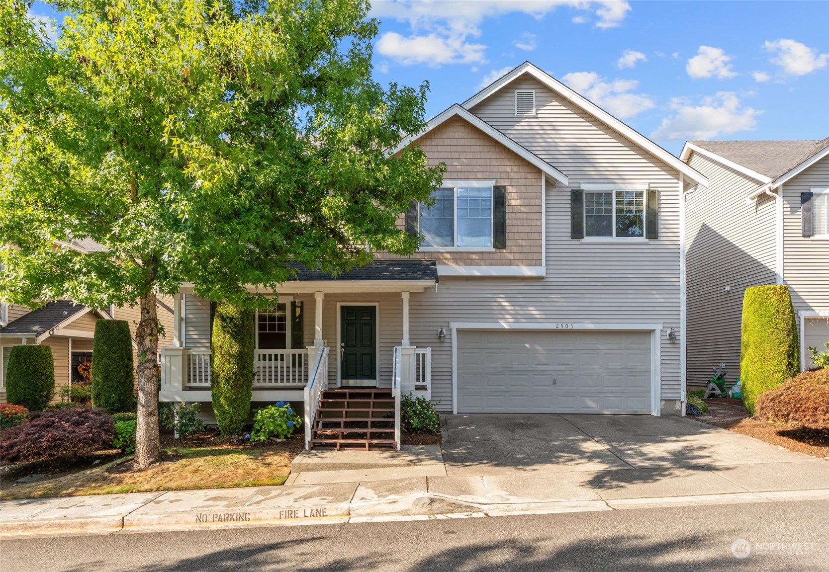 2505 194th Street Southeast Bothell, WA 98012 - Photo 1 of 31 a view of a house with a yard and large tree