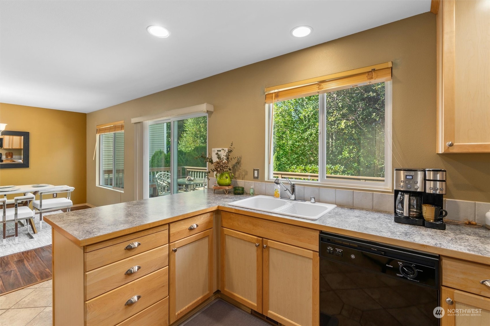 2505 194th Street Southeast Bothell, WA 98012 - Photo 12 of 31 a kitchen with granite countertop cabinets a sink and a large window
