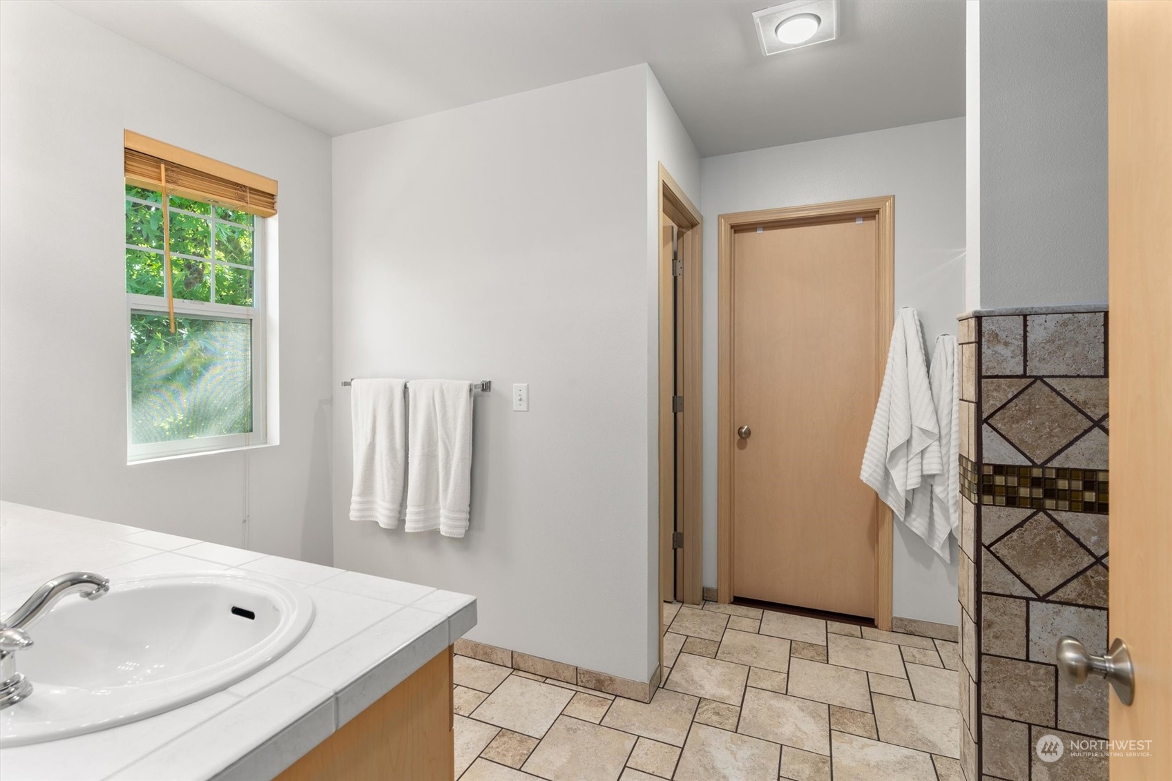 2505 194th Street Southeast Bothell, WA 98012 - Photo 18 of 31 a bathroom with a tub and a sink
