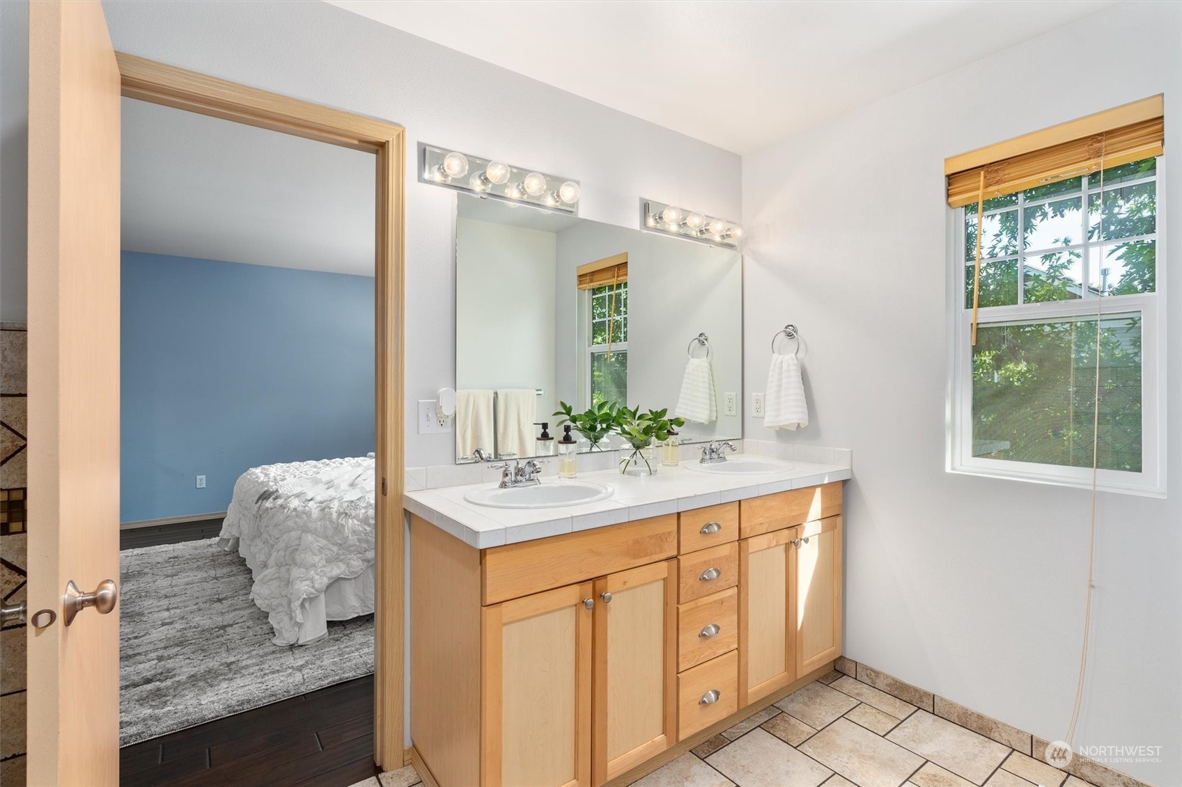 2505 194th Street Southeast Bothell, WA 98012 - Photo 19 of 31 a en suite bathroom with a granite countertop sink and a mirror