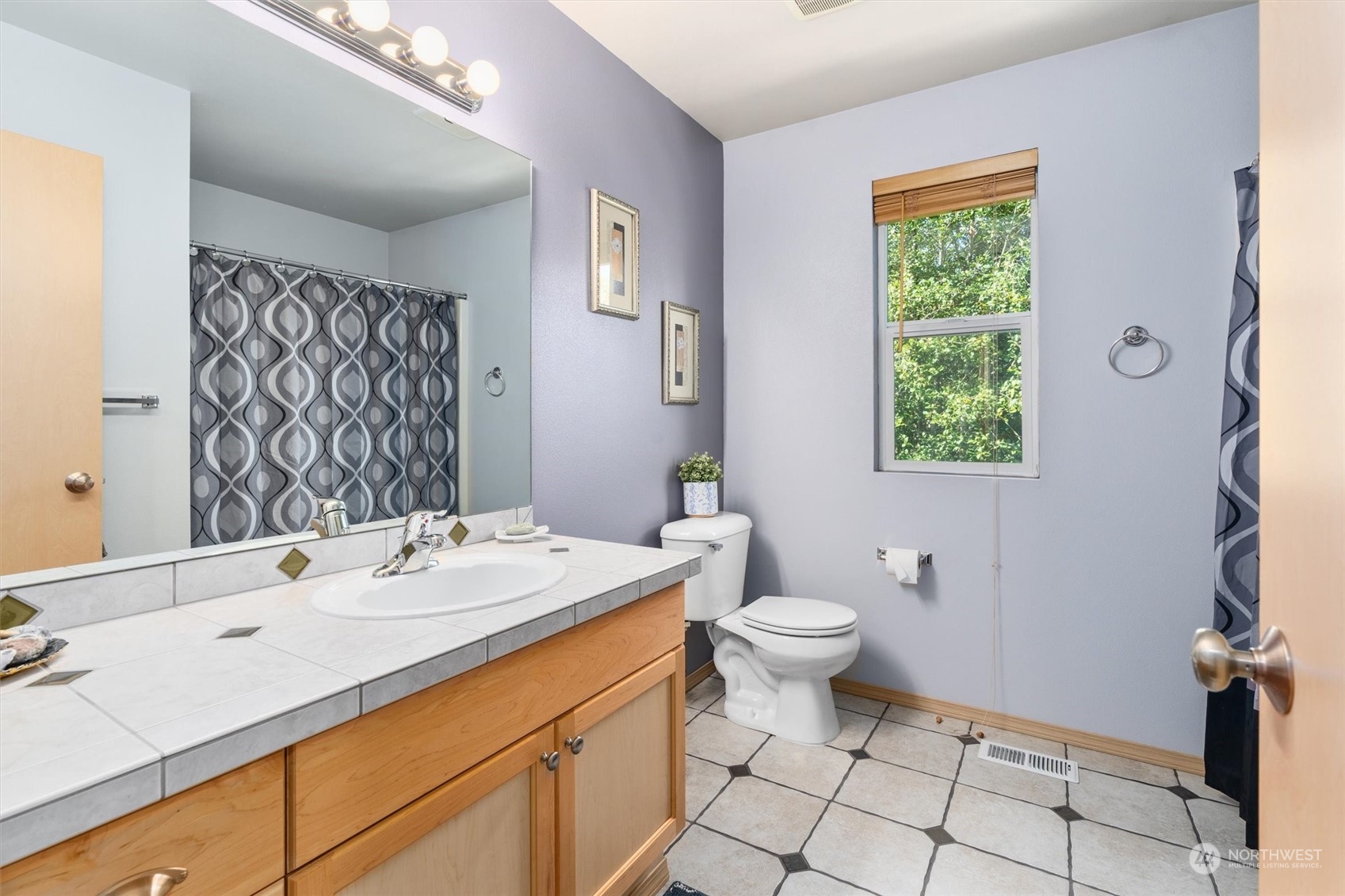 2505 194th Street Southeast Bothell, WA 98012 - Photo 22 of 31 a bathroom with a sink toilet and mirror