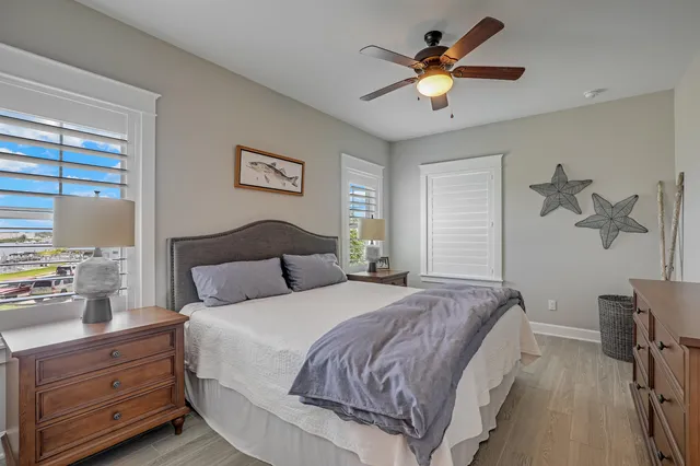 a bedroom with a bed and a chair