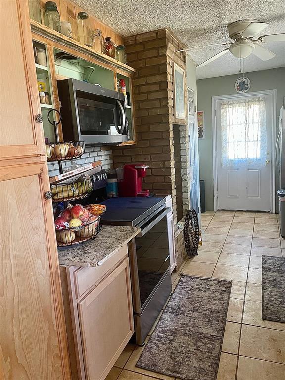 3640 Van Zandt County Road Ben Wheeler, TX 75754 - Photo 21 of 34 a kitchen view of a stove and a microwave