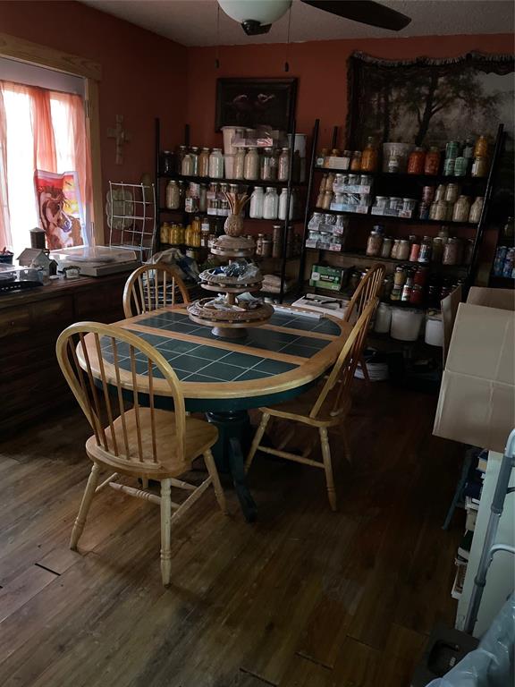3640 Van Zandt County Road Ben Wheeler, TX 75754 - Photo 25 of 34 a dining room with furniture and wooden floor