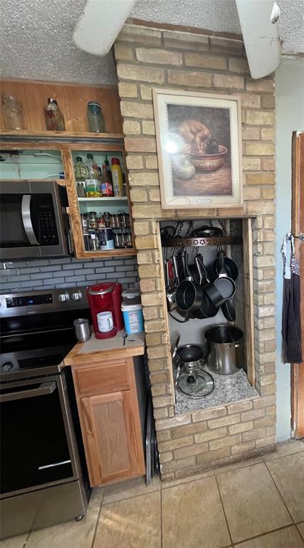 3640 Van Zandt County Road Ben Wheeler, TX 75754 - Photo 28 of 34 a kitchen with a stove and cabinets