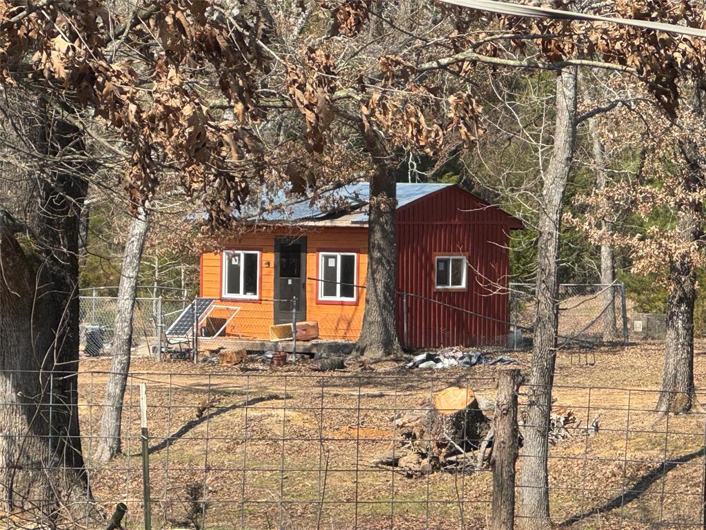 3640 Van Zandt County Road Ben Wheeler, TX 75754 - Photo 30 of 34 a front view of a house with yard