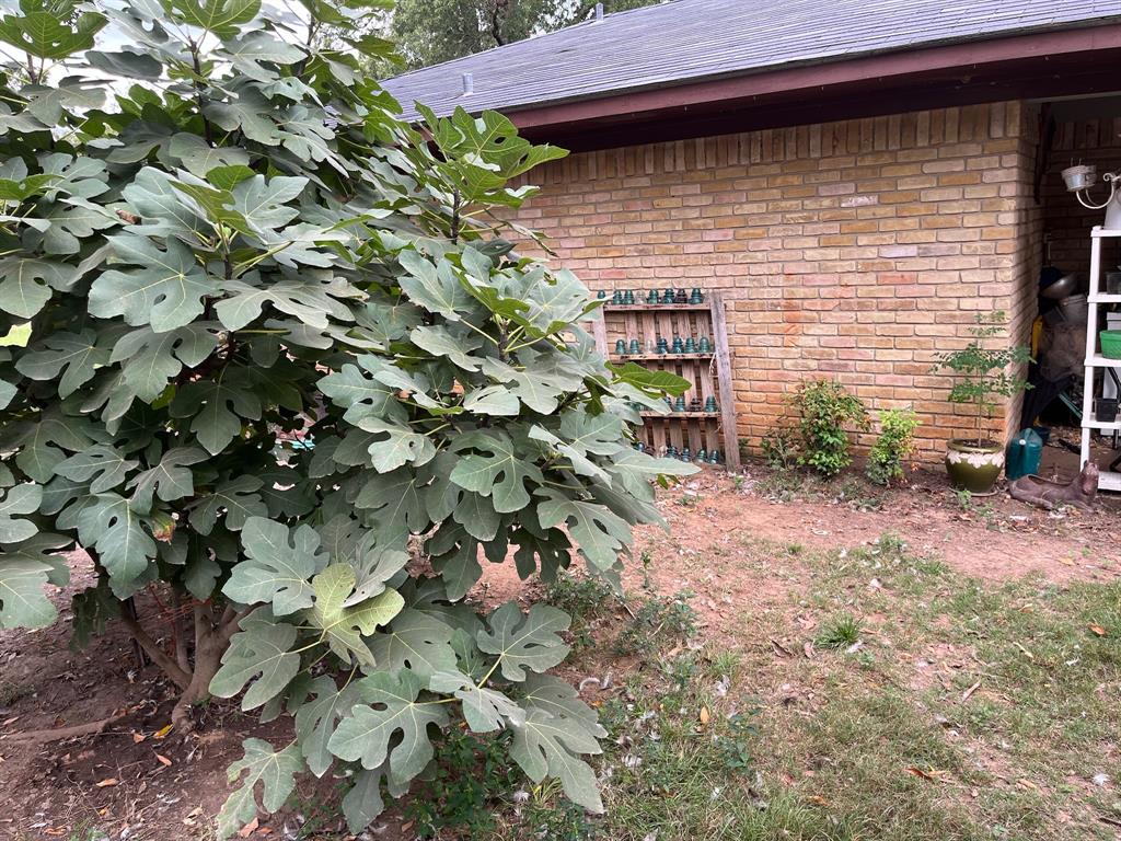 3640 Van Zandt County Road Ben Wheeler, TX 75754 - Photo 4 of 34 a brick building with a small yard