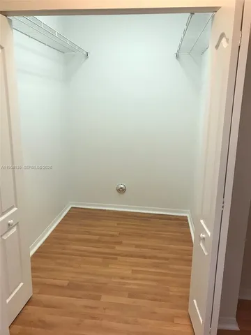 a bath tub sitting in a bathroom next to a window