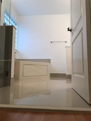 a bathroom with a double vanity sink and mirror