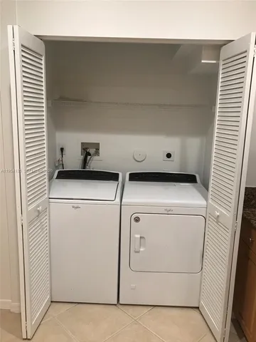 an empty room with wooden floor and closet
