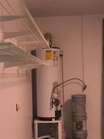 a kitchen with stainless steel appliances granite countertop a refrigerator sink and stove