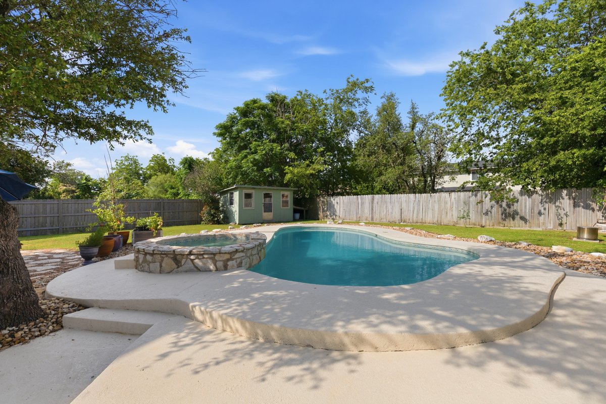 12400 Rusted Nail Cove Austin, TX 78750 - Photo 26 of 31 A private backyard oasis awaits! The backyard shed provides convenient additional storage for tools, equipment, or seasonal items.