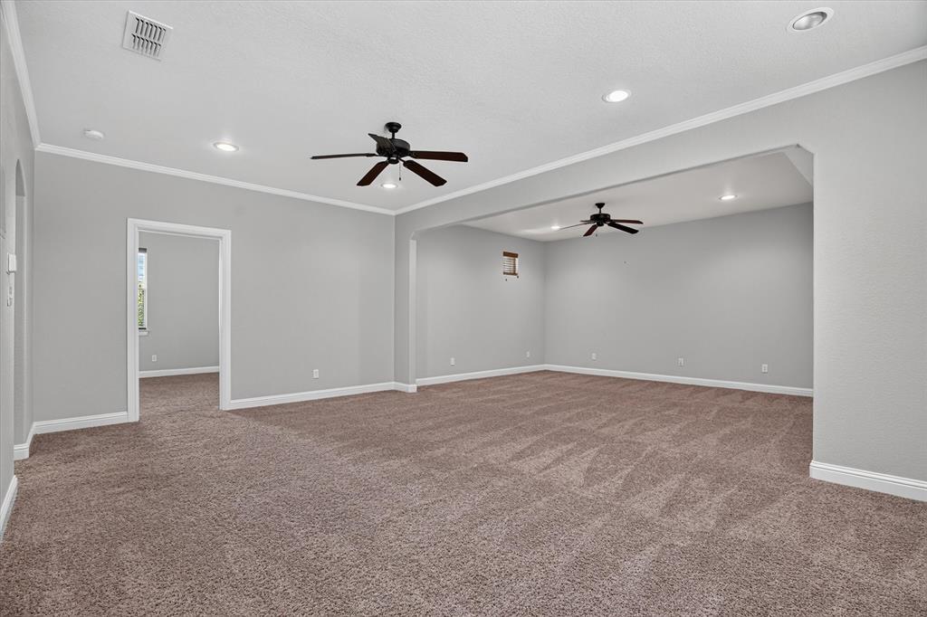 100 Canyon Ridge Trail Aledo, TX 76008 - Photo 17 of 38 Expansive carpeted room with multiple recessed lights and two ceiling fans