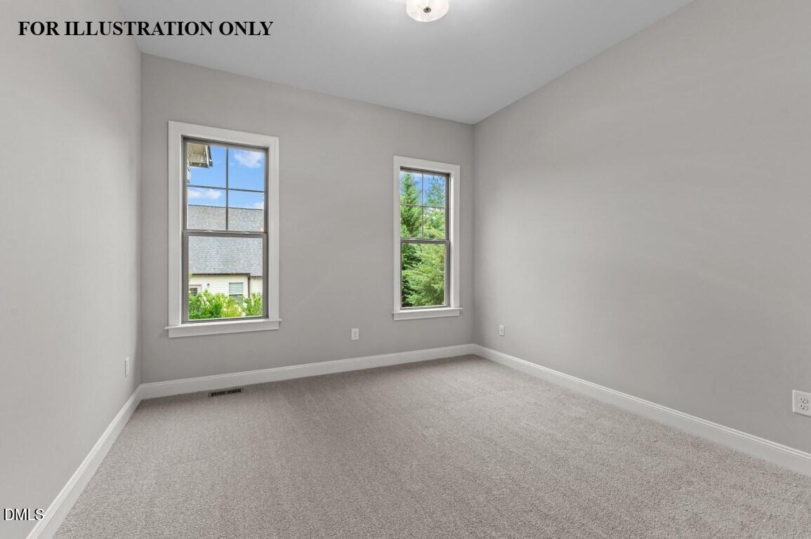 1032 Smoke Willow Way, Unit 148 Rolesville, NC 27571 - Photo 13 of 20 an empty room with windows