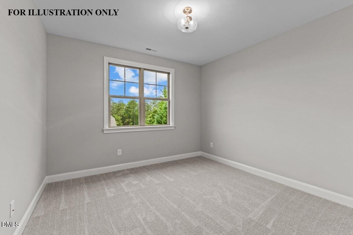 1032 Smoke Willow Way, Unit 148 Rolesville, NC 27571 - Photo 15 of 20 an empty room with a window