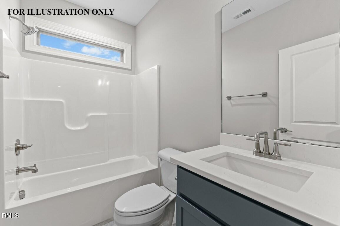 1032 Smoke Willow Way, Unit 148 Rolesville, NC 27571 - Photo 16 of 20 a bathroom with a granite countertop sink toilet and shower