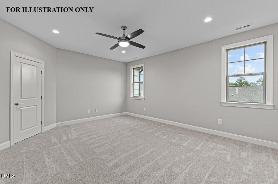 1032 Smoke Willow Way, Unit 148 Rolesville, NC 27571 - Photo 17 of 20 a view of an empty room with a window