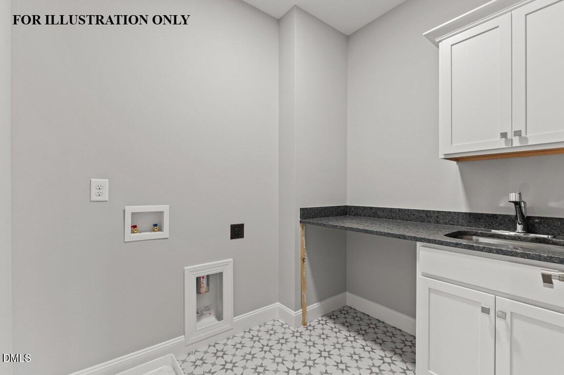 1032 Smoke Willow Way, Unit 148 Rolesville, NC 27571 - Photo 19 of 20 a kitchen with granite countertop a sink and cabinets