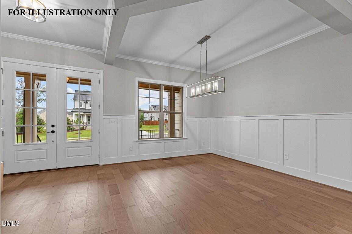 1032 Smoke Willow Way, Unit 148 Rolesville, NC 27571 - Photo 2 of 20 an empty room with wooden floor chandelier and windows