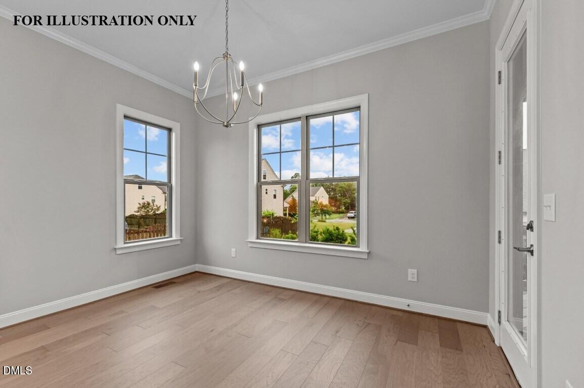 1032 Smoke Willow Way, Unit 148 Rolesville, NC 27571 - Photo 5 of 20 an empty room with windows and chandelier