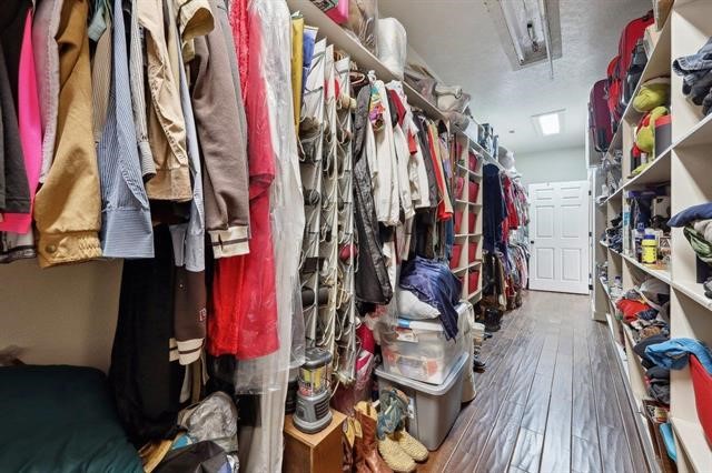 2014 Fish Lake Road Kountze, TX 77625 - Photo 12 of 35 a view of walk in closet with clothes and shoes