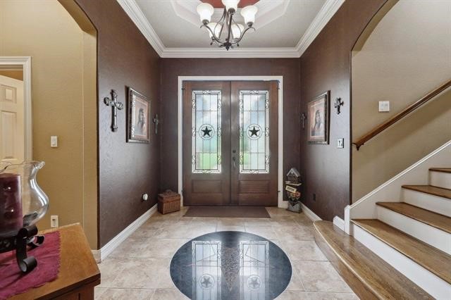 2014 Fish Lake Road Kountze, TX 77625 - Photo 19 of 35 a view of a hallway with entryway and chandelier